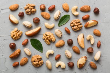 Composition of nuts , flat lay - mix hazelnuts, cashews, almonds on table background. healthy eating concepts and food background.