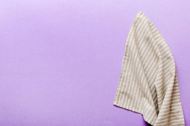 top view with gray kitchen napkin isolated on table background. Folded cloth for mockup with copy space, Flat lay. Minimal style.