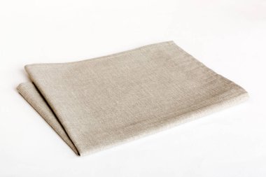 top view with gray kitchen napkin isolated on table background. Folded cloth for mockup with copy space, Flat lay. Minimal style.