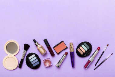 Professional makeup tools. Top view. Flat lay. Beauty, decorative cosmetics. Makeup brushes set and color eyeshadow palette on table background. Minimalistic style.