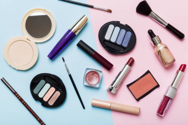 Professional makeup tools. Top view. Flat lay. Beauty, decorative cosmetics. Makeup brushes set and color eyeshadow palette on table background. Minimalistic style.