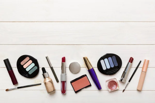 Professional makeup tools. Top view. Flat lay. Beauty, decorative cosmetics. Makeup brushes set and color eyeshadow palette on table background. Minimalistic style.