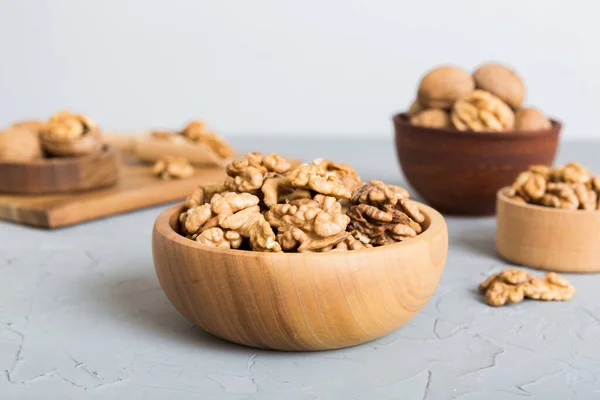 stock image Fresh healthy walnuts in bowl on colored table background. Top view Healthy eating bertholletia concept. Super foods.