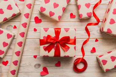 Creative gift box with decorations for the holiday, top view. Birthday and valentine present.