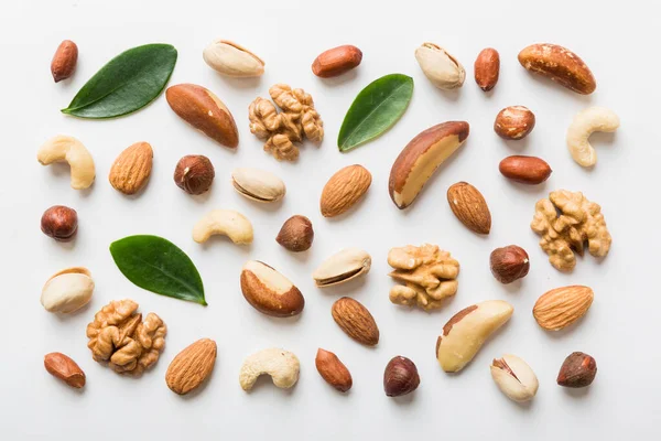 stock image Composition of nuts , flat lay - mix hazelnuts, cashews, almonds on table background. healthy eating concepts and food background.