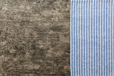 top view with blue kitchen napkin isolated on table background. Folded cloth for mockup with copy space, Flat lay. Minimal style.