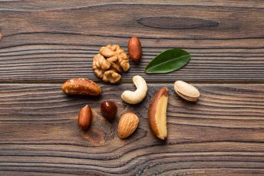 Composition of nuts , flat lay - mix hazelnuts, cashews, almonds on table background. healthy eating concepts and food background.