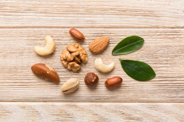 Composition of nuts , flat lay - mix hazelnuts, cashews, almonds on table background. healthy eating concepts and food background.