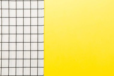 top view with white empty kitchen napkin isolated on table background. Folded cloth for mockup with copy space, Flat lay. Minimal style.