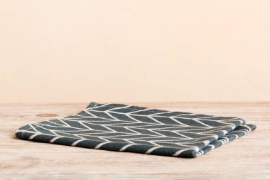 top view with blue kitchen napkin isolated on table background. Folded cloth for mockup with copy space, Flat lay. Minimal style.