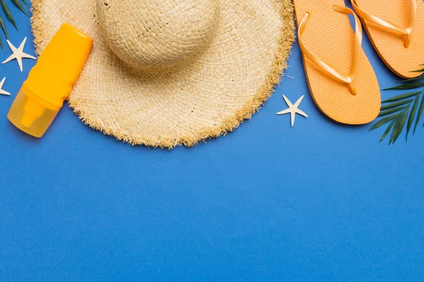 Summer vacation concept flat lay. straw hat beach accessories and towel top view. Space for text. travel concept.