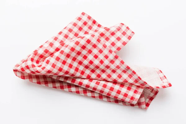 stock image top view with red empty kitchen napkin isolated on table background. Folded cloth for mockup with copy space, Flat lay. Minimal style.