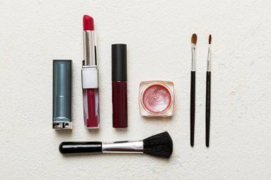 Professional makeup tools. Top view. Flat lay. Beauty, decorative cosmetics. Makeup brushes set and color eyeshadow palette on table background. Minimalistic style.