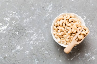 cashew nuts in wooden bowl on table background. top view. Space for text. Healthy food