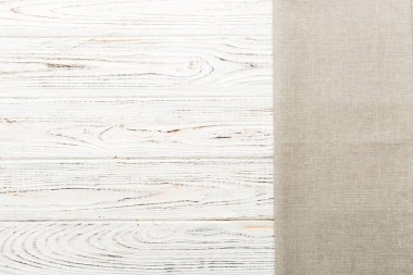 top view with gray kitchen napkin isolated on table background. Folded cloth for mockup with copy space, Flat lay. Minimal style.