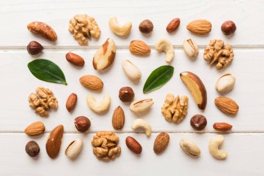 Composition of nuts , flat lay - mix hazelnuts, cashews, almonds on table background. healthy eating concepts and food background.