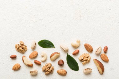 Composition of nuts , flat lay - mix hazelnuts, cashews, almonds on table background. healthy eating concepts and food background.