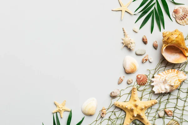 stock image Summer time concept Flat lay composition with beautiful starfish and sea shells on colored table, top view with copy space for text.