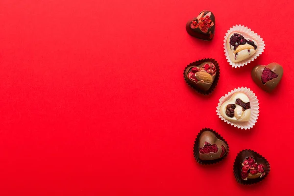 Chocolate Sweets Form Heart Fruits Nuts Colored Background Top View — Foto Stock