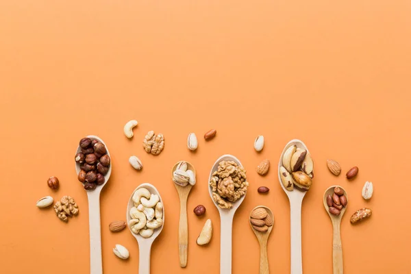 Mixed Nuts White Wooden Spoon Mix Various Nuts Colored Background — Foto de Stock