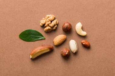 Composition of nuts , flat lay - mix hazelnuts, cashews, almonds on table background. healthy eating concepts and food background.