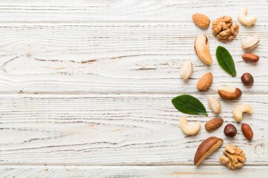 Composition of nuts , flat lay - mix hazelnuts, cashews, almonds on table background. healthy eating concepts and food background.