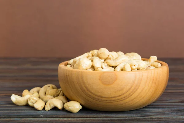 Cashew Nuts Wooden Bowl Table Background Top View Space Text — Foto de Stock