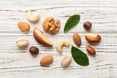 Composition of nuts , flat lay - mix hazelnuts, cashews, almonds on table background. healthy eating concepts and food background.