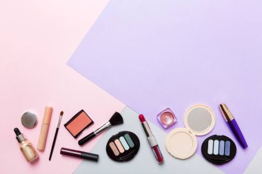 Professional makeup tools. Top view. Flat lay. Beauty, decorative cosmetics. Makeup brushes set and color eyeshadow palette on table background. Minimalistic style.