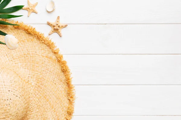 Stock image Summer holidays. Summer concept with straw hat and tropical leaf. Flat lay, top view, copy space.