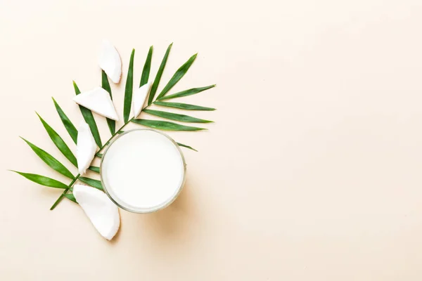 stock image coconut products on white wooden table background. Dairy free milk substitute drink, Flat lay healthy eating.