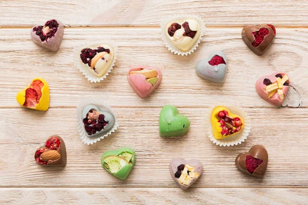 Chocolate Sweets Form Heart Fruits Nuts Colored Background Top View — Stock fotografie