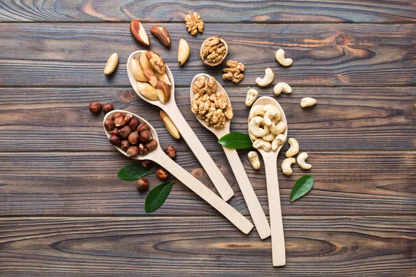 Mixed Nuts White Wooden Spoon Mix Various Nuts Colored Background — Foto de Stock