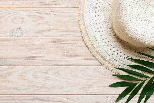 stock image Summer holidays. Summer concept with straw hat and tropical leaf. Flat lay, top view, copy space.