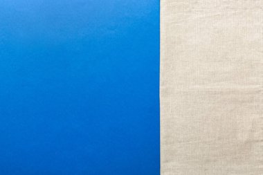 top view with gray kitchen napkin isolated on table background. Folded cloth for mockup with copy space, Flat lay. Minimal style.