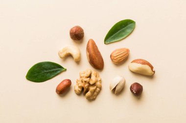 Composition of nuts , flat lay - mix hazelnuts, cashews, almonds on table background. healthy eating concepts and food background.