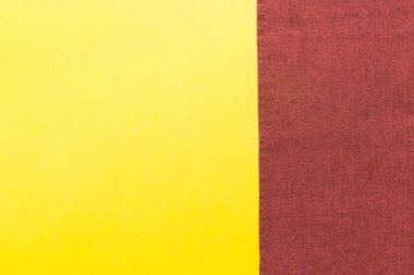 top view with red empty kitchen napkin isolated on table background. Folded cloth for mockup with copy space, Flat lay. Minimal style.