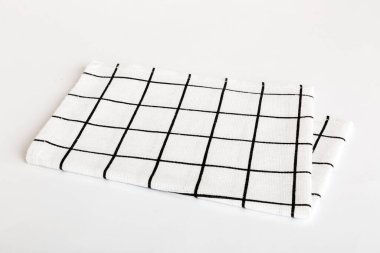 top view with white empty kitchen napkin isolated on table background. Folded cloth for mockup with copy space, Flat lay. Minimal style.