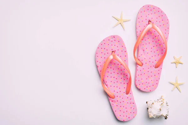 Flat Lay Composition Flip Flops Seashell Colored Background Space Text — Stockfoto