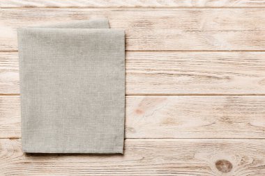 top view with gray kitchen napkin isolated on table background. Folded cloth for mockup with copy space, Flat lay. Minimal style.
