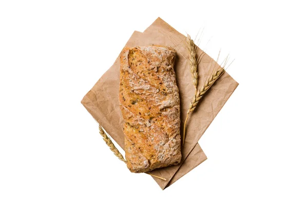 新鲜自制全麦面包 餐巾纸上的面包 白色背景 新鲜面包顶部视图 — 图库照片