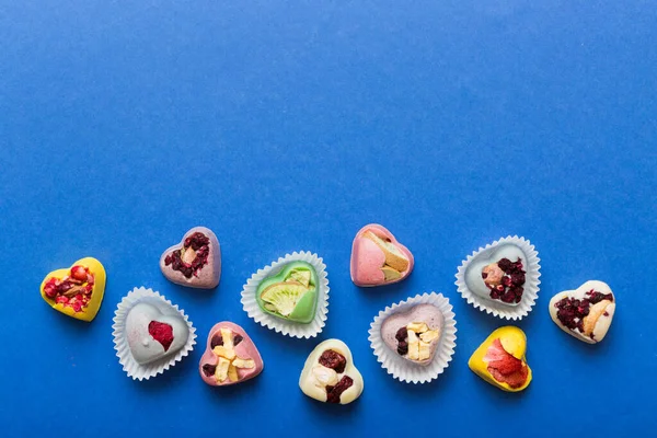 Chocolate Sweets Form Heart Fruits Nuts Colored Background Top View — Foto de Stock