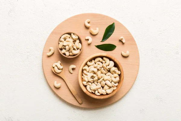 stock image cashew nuts in wooden bowl on table background. top view. Space for text. Healthy food