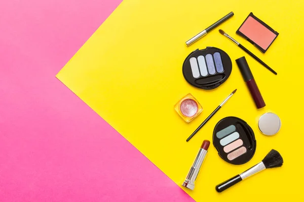 stock image Professional makeup tools. Top view. Flat lay. Beauty, decorative cosmetics. Makeup brushes set and color eyeshadow palette on table background. Minimalistic style.