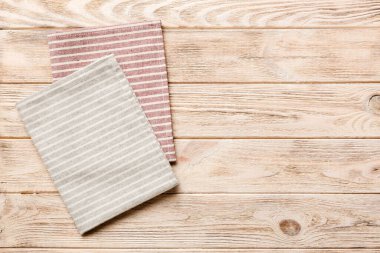 top view with gray kitchen napkin isolated on table background. Folded cloth for mockup with copy space, Flat lay. Minimal style.
