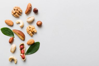 Composition of nuts , flat lay - mix hazelnuts, cashews, almonds on table background. healthy eating concepts and food background.