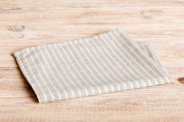 top view with gray kitchen napkin isolated on table background. Folded cloth for mockup with copy space, Flat lay. Minimal style.