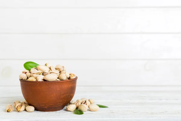 stock image Fresh healthy Pistachios in bowl on colored table background. Top view. Healthy eating concept. Super foods.