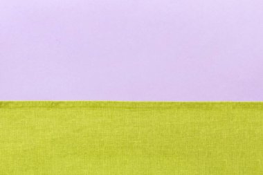 top view with green kitchen napkin isolated on table background. Folded cloth for mockup with copy space, Flat lay. Minimal style.