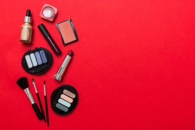 Professional makeup tools. Top view. Flat lay. Beauty, decorative cosmetics. Makeup brushes set and color eyeshadow palette on table background. Minimalistic style.